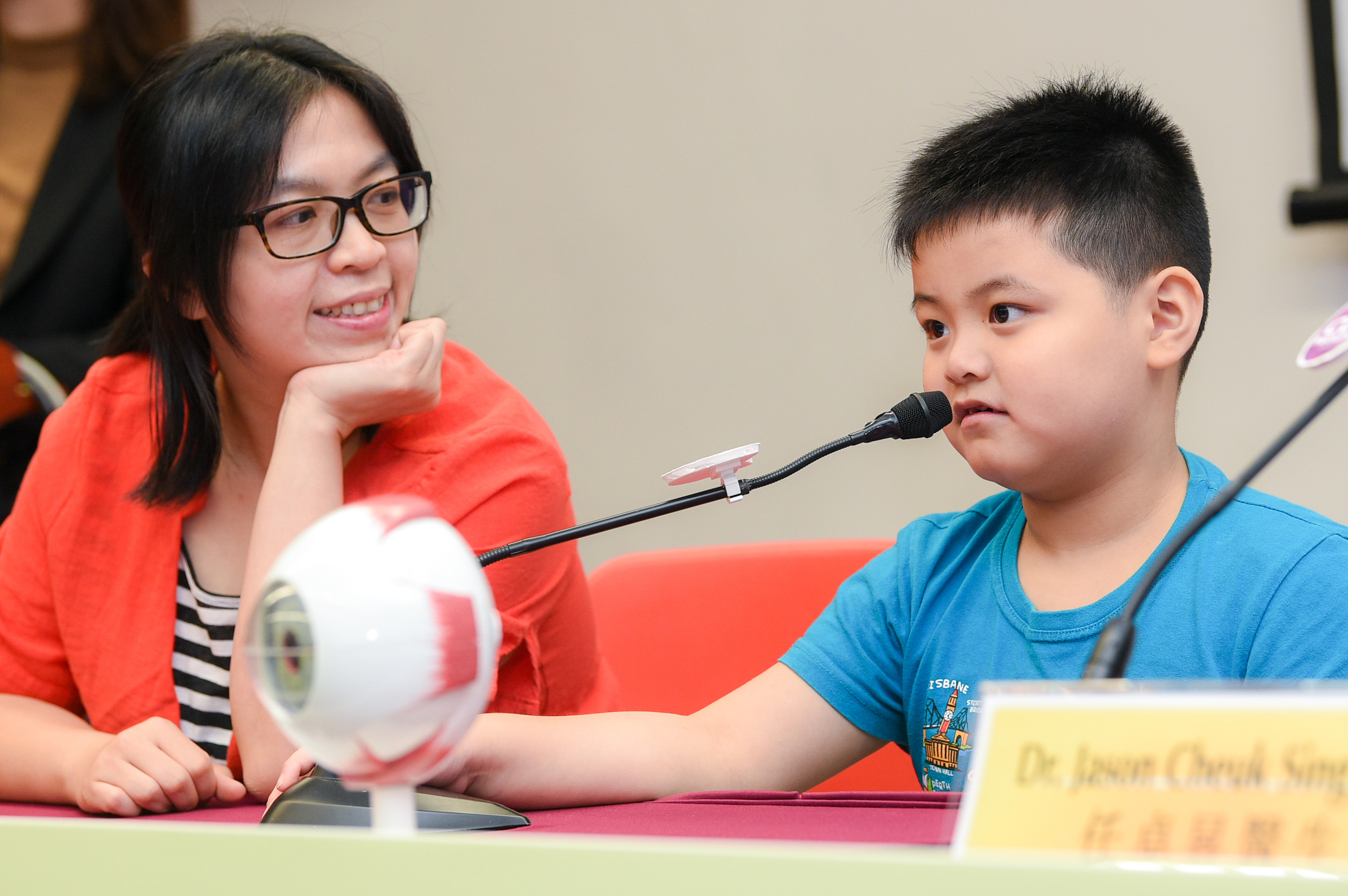 Gerrick (right) spends three to four hours watching TV or using smartphones every day. His mother Mrs. Tsang says in order to help his son prevent from myopia progression, she got him to join the LAMP study and will limit the time he spend on electronic devices in the future. 