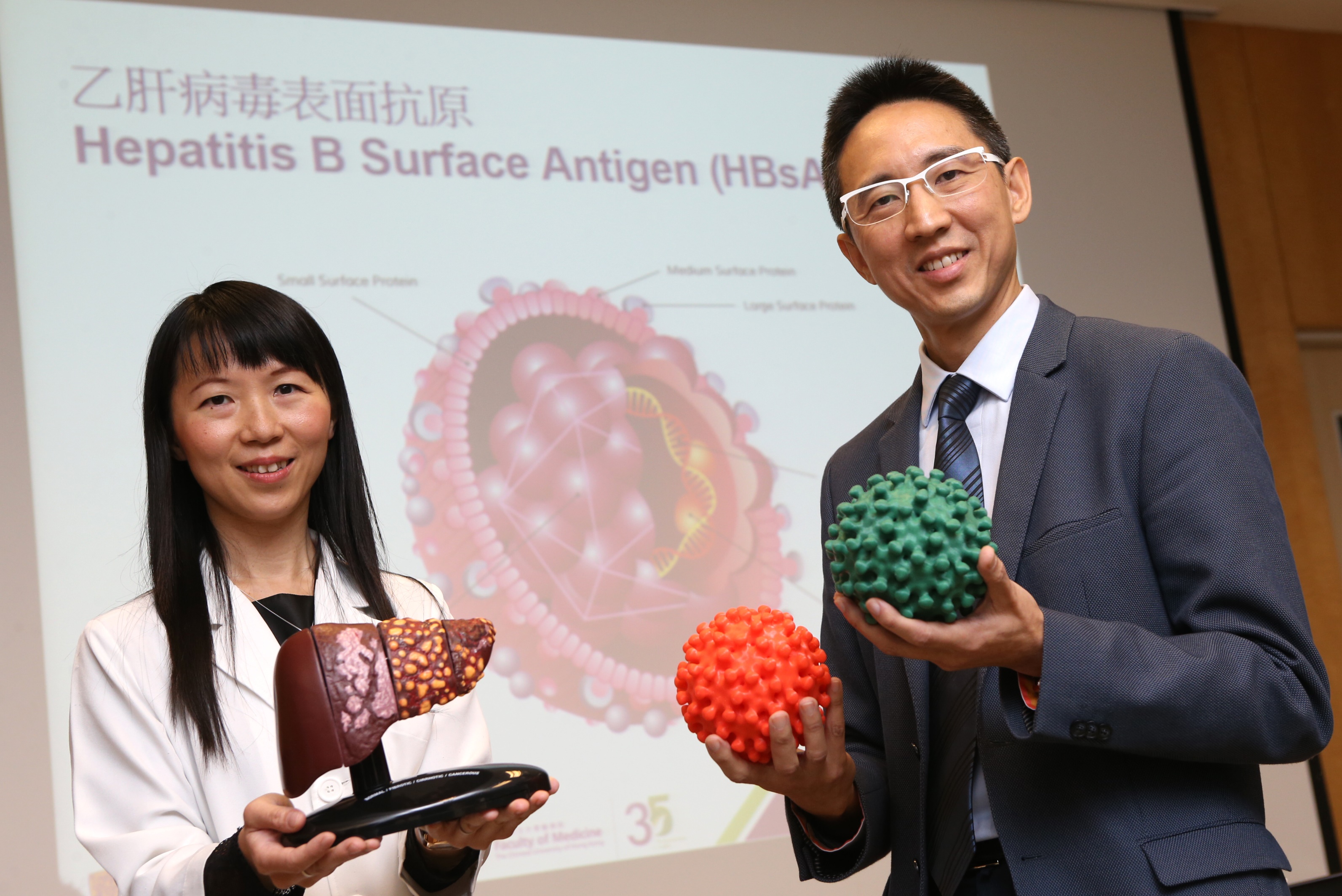 Researchers from the Faculty of Medicine of The Chinese University of Hong Kong (CUHK) find that patients with seroclearance of hepatitis B surface antigen (HBsAg), which means recovery of hepatitis B, are still at risk of developing liver cancer. Study results show that male patients who achieved recovery after the age of 50 have a higher risk. Featured are (right) Professor Henry CHAN, Director of the Center for Liver Health, Faculty of Medicine at CUHK, and Professor Grace WONG, Division of Gastroenterology and Hepatology, Department of Medicine and Therapeutics, Faculty of Medicine at CUHK.