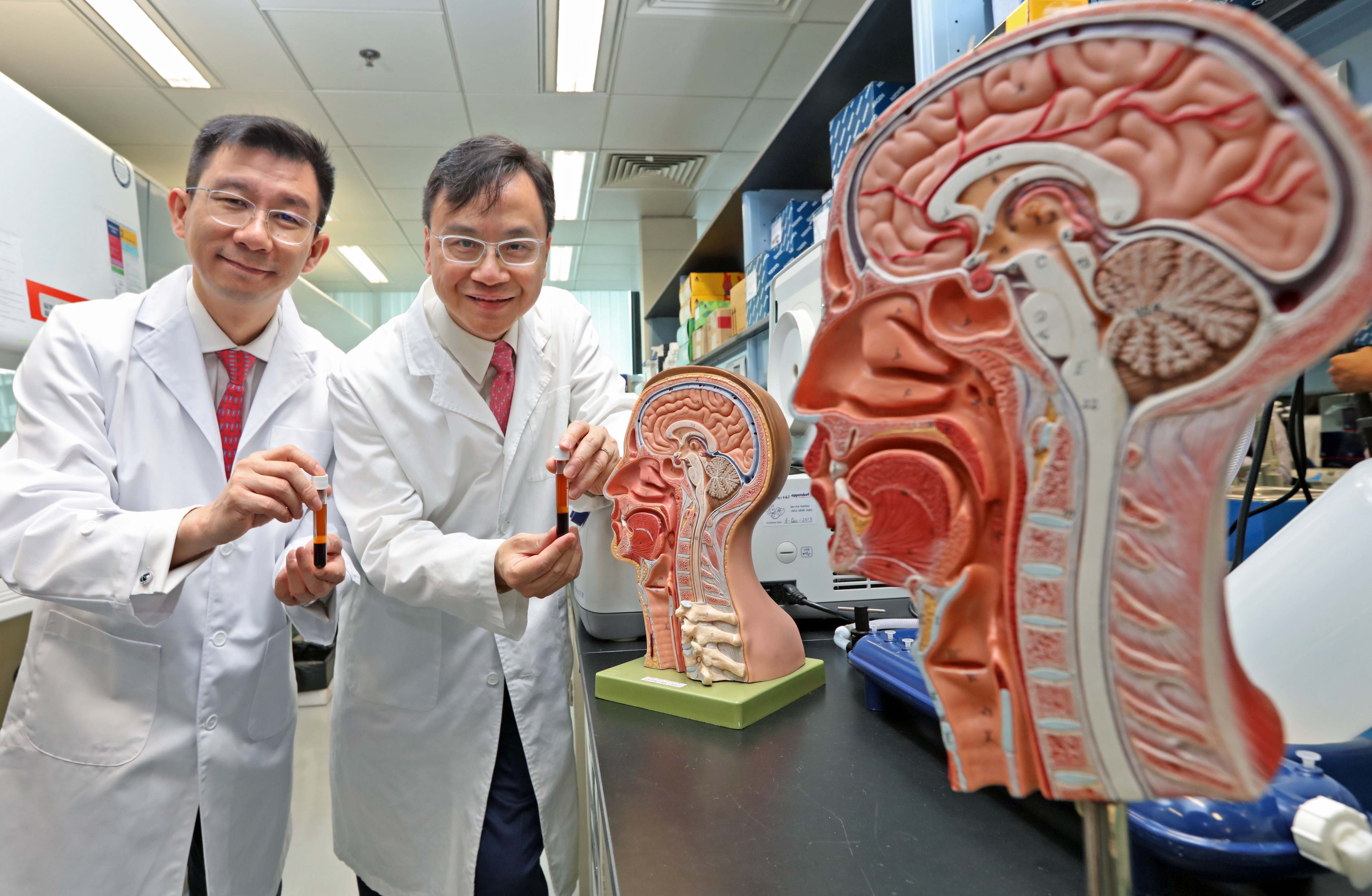 The Chinese University of Hong Kong (CUHK) recently completed a 20,000-person study and confirms that plasma Epstein-Barr virus (EBV) DNA analysis is useful for screening early asymptomatic nasopharyngeal carcinoma (NPC). The findings have just been released in the New England Journal of Medicine. Featured are (right) Professor Dennis LO, Director of the Li Ka Shing Institute of Health Sciences at CUHK, and Professor Allen CHAN from the Department of Chemical Pathology, Faculty of Medicine at CUHK.
