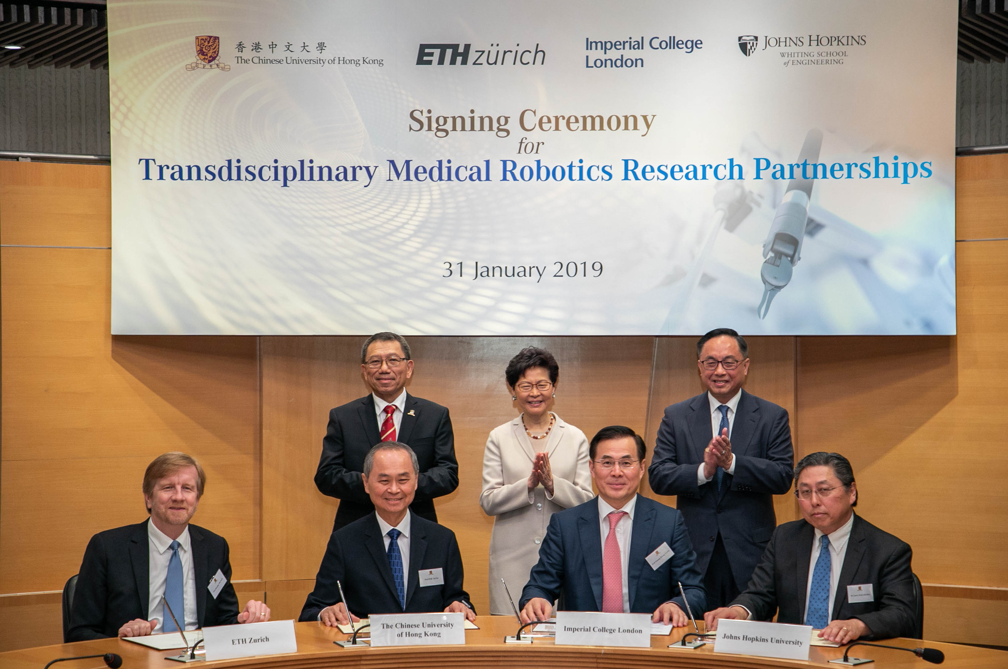 The Chinese University of Hong Kong (CUHK) established partnerships with ETH Zurich, Imperial College London and Johns Hopkins University to deepen ties on transdisciplinary medical robotics research. The event was witnessed by The Hon Mrs. Carrie LAM CHENG Yuet-ngor (back row center), The Chief Executive of the Hong Kong Special Administrative Region (HKSAR); Professor Rocky S. TUAN (back row left), Vice-Chancellor and President of CUHK; and Mr. Nicholas W. YANG (back row right), Secretary for Innovation and Technology of the HKSAR Government.