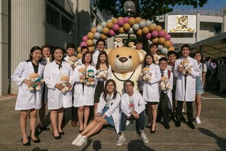 CU Medicine Medical freshmen took picture with the signature medic giant bear