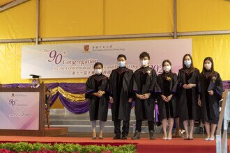 Group photo of graduates on stage 