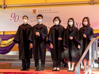 Group photo of graduates on stage 