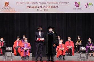 Dr. Sunny CHAI presents the awards to awardee Mr. KO Ching Ho, Medical graduate, who received 10 awards in total.