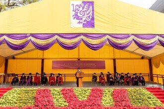 Group photo of procession members on stage