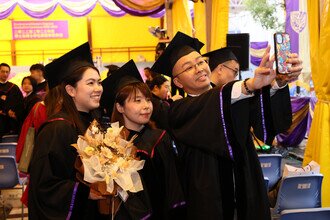 Graduates being blessed and congratulated by Faculty member