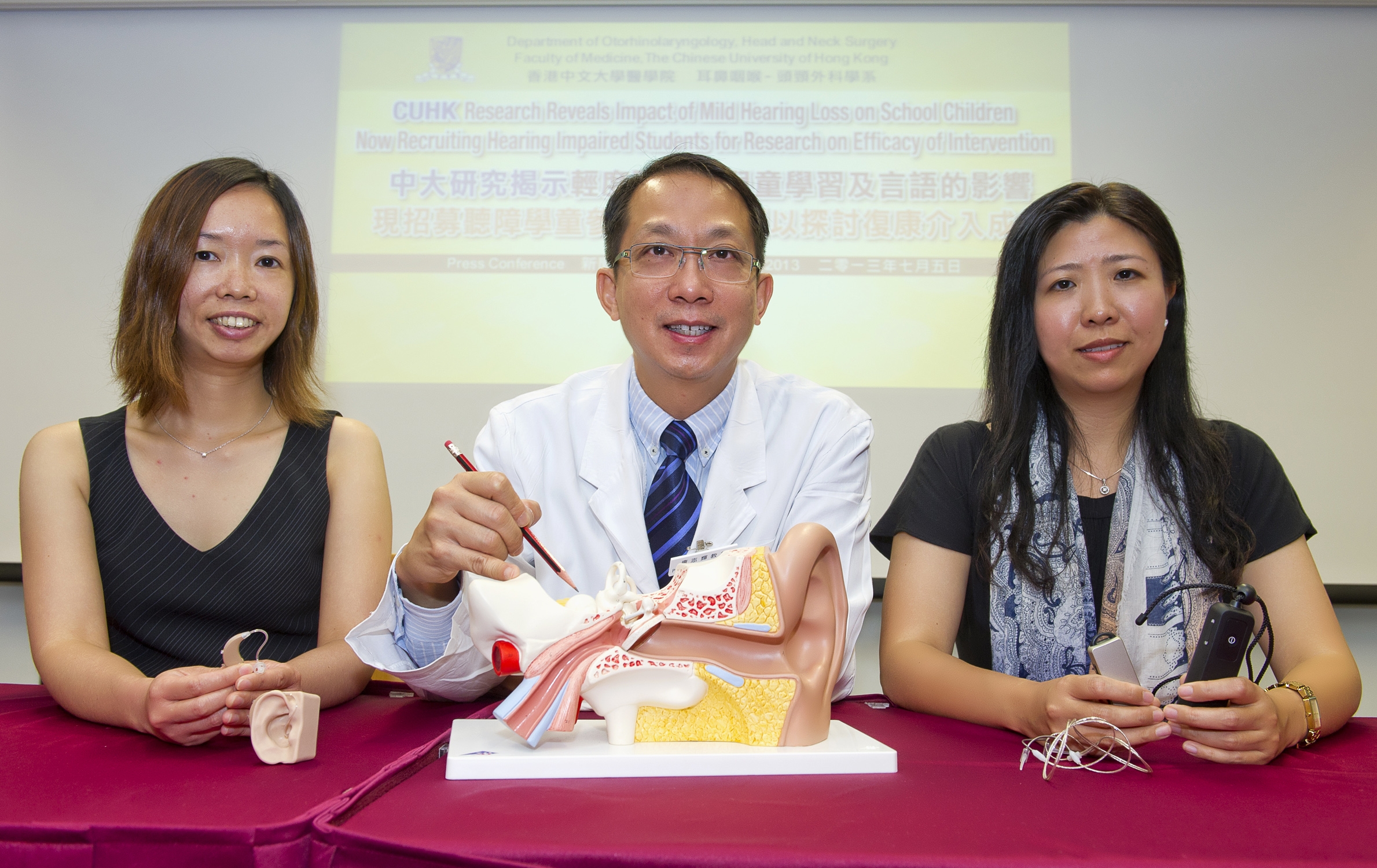 (from left) Miss Iris NG, Professor Michael TONG and Professor Anna KAM introduce the hearing system and hearing aid for the hearing impaired children