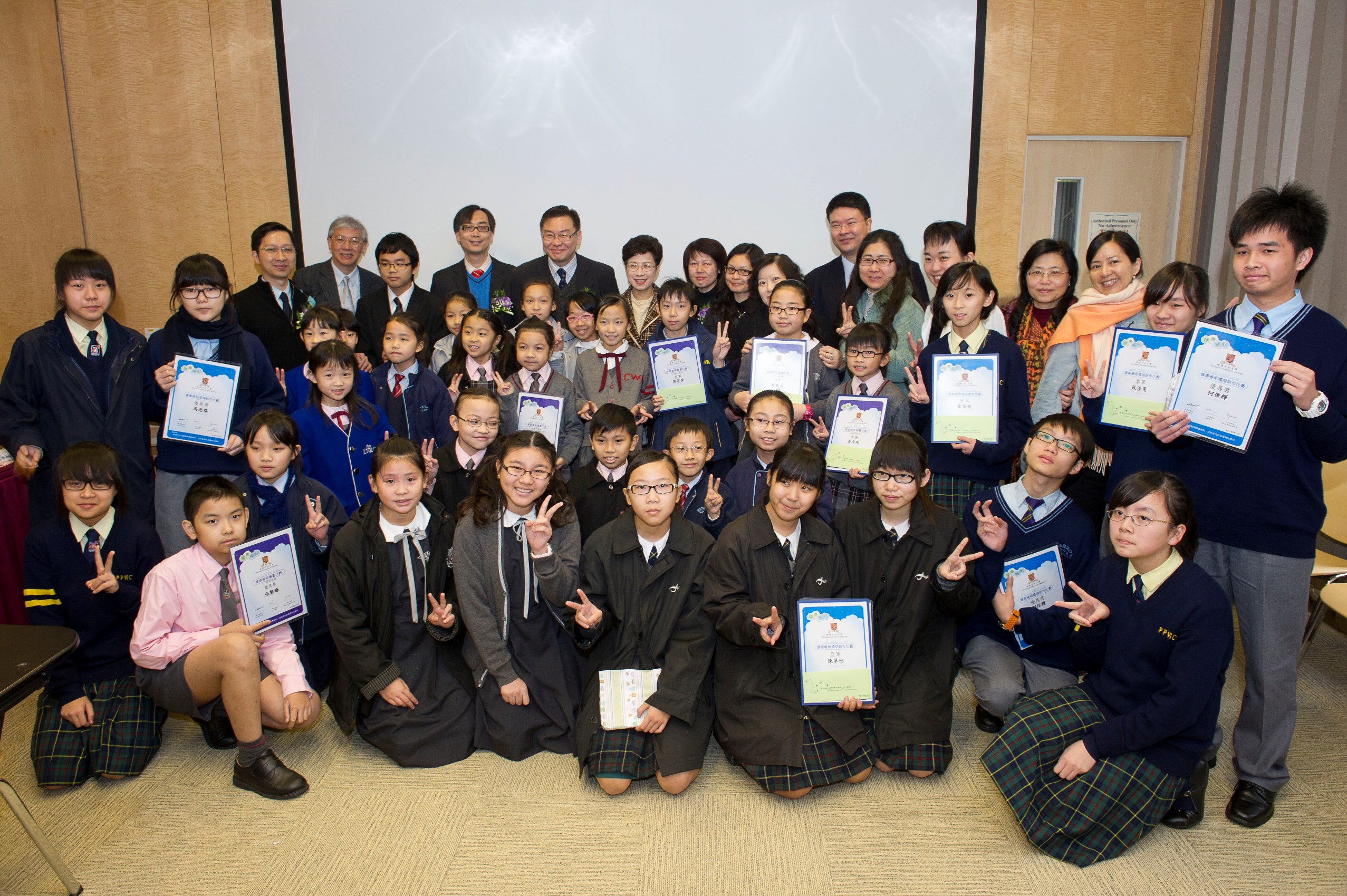 CUHK's research team, some of the students receiving awards from the Healthy Sleep Painting Competition and Healthy Sleep Slogan Competition of the territory-wide Sleep Health Education and Intervention Campaign, together with their school headmasters and teachers