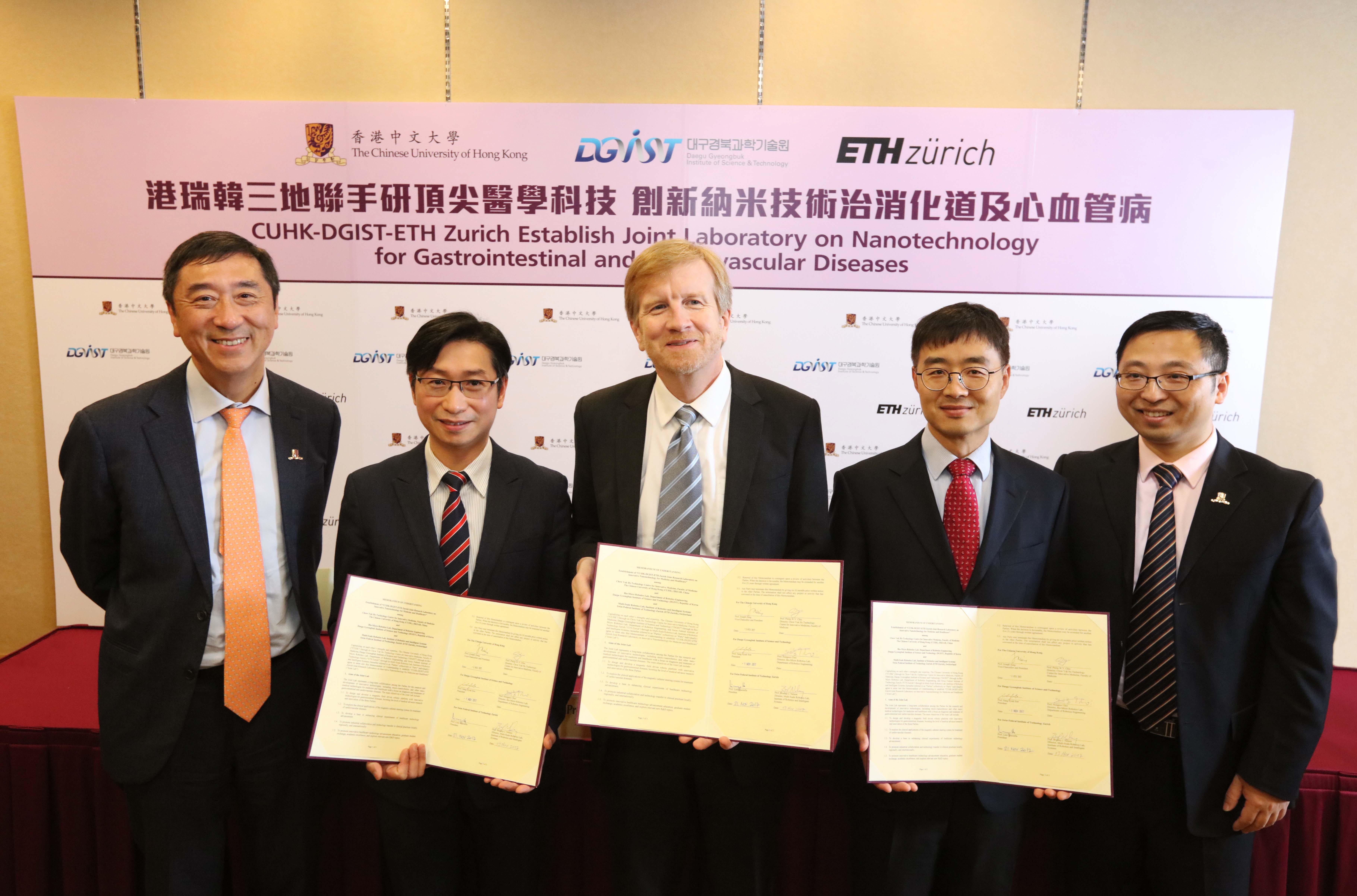 (From left) Prof. Joseph SUNG, Vice-Chancellor and President of CUHK; Prof. Philip CHIU, Director of the Chow Yuk Ho Technology Centre for Innovative Medicine, CUHK; Prof. Dr. Bradley NELSON, Director of the Multi-Scale Robotics Lab, Institute of Robotics and Intelligent Systems, ETH Zurich; Prof. Hongsoo CHOI, Director of the Bio-Micro Robotics Lab, Department of Robotic Engineering, DGIST and Prof. Li ZHANG, Associate Professor, Department of Mechanical and Automation Engineering, CUHK, take a group photo after signing the MOU to establish a Joint Research Laboratory on Innovative Nanotechnologies for Medicine and Healthcare