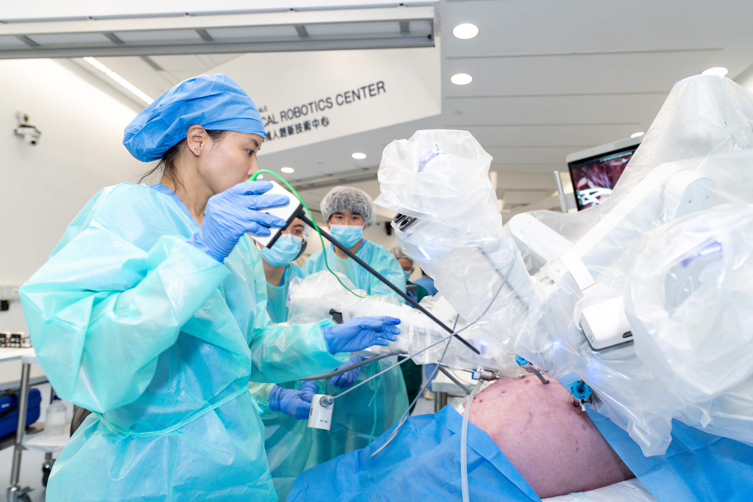 Featured are Dr Chan in Hong Kong, assisted by two CUHK medical students