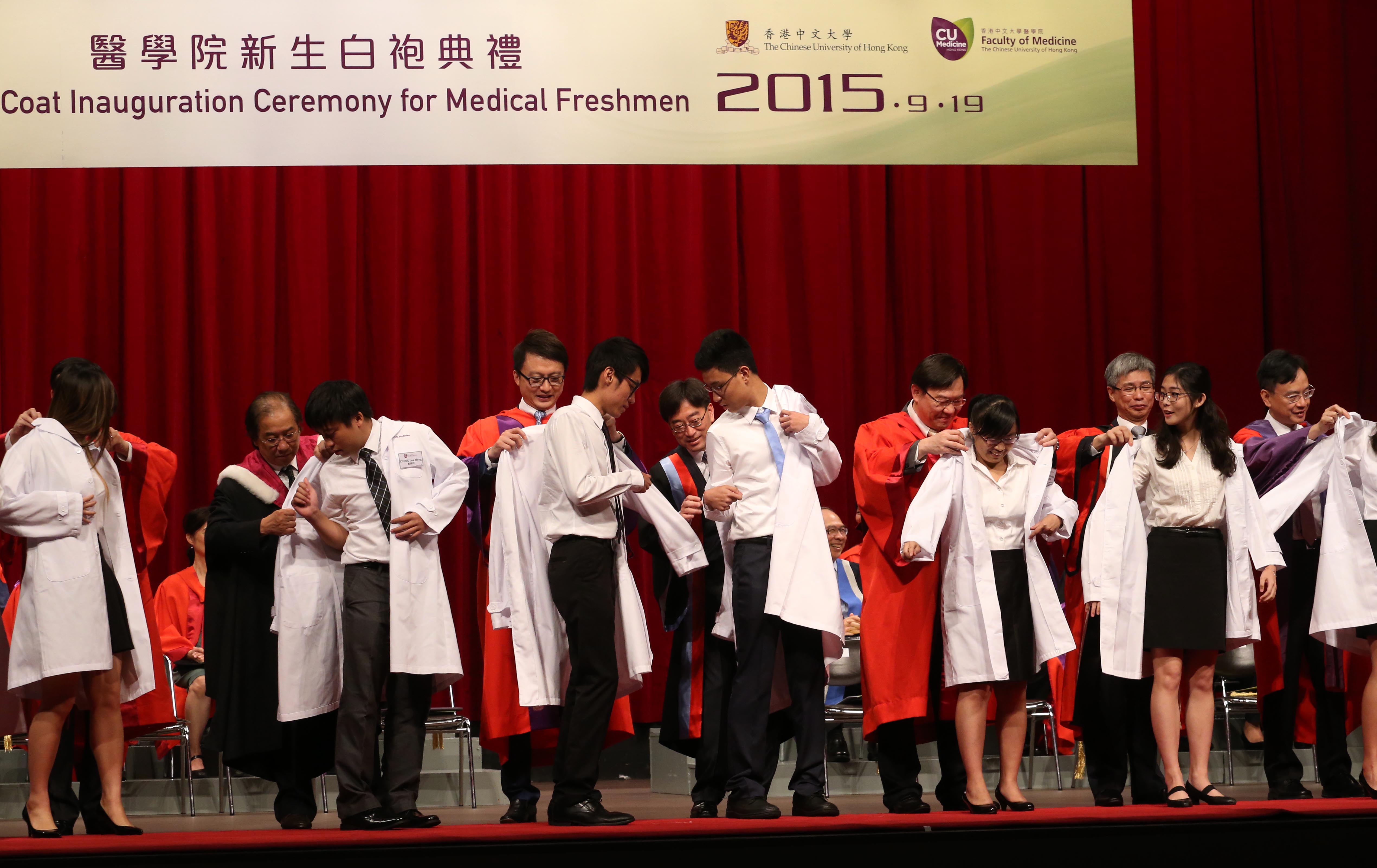 White coats are solemnly conferred on over 200 newly admitted medical students 