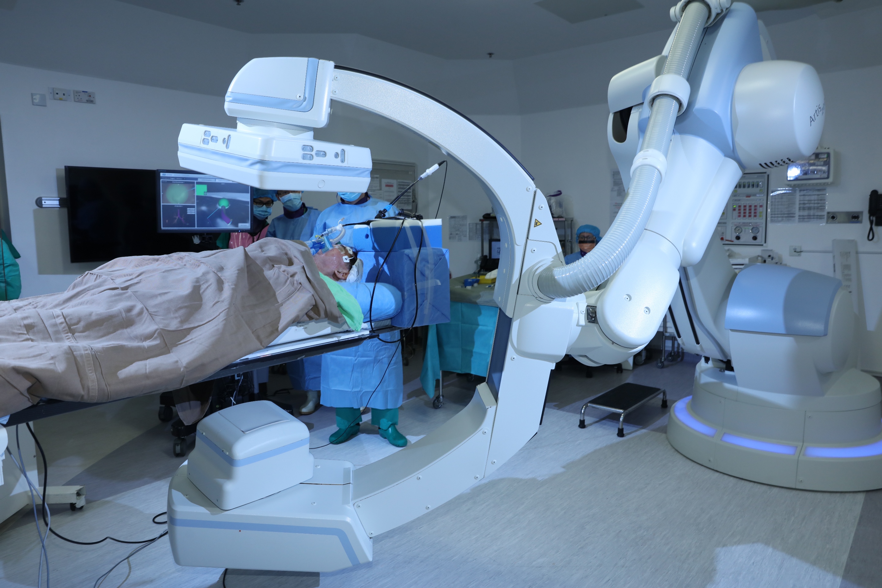 The actual scene showing the combined use of Electromagnetic Navigation Bronchoscopy (ENB) with Hybrid Operating Room